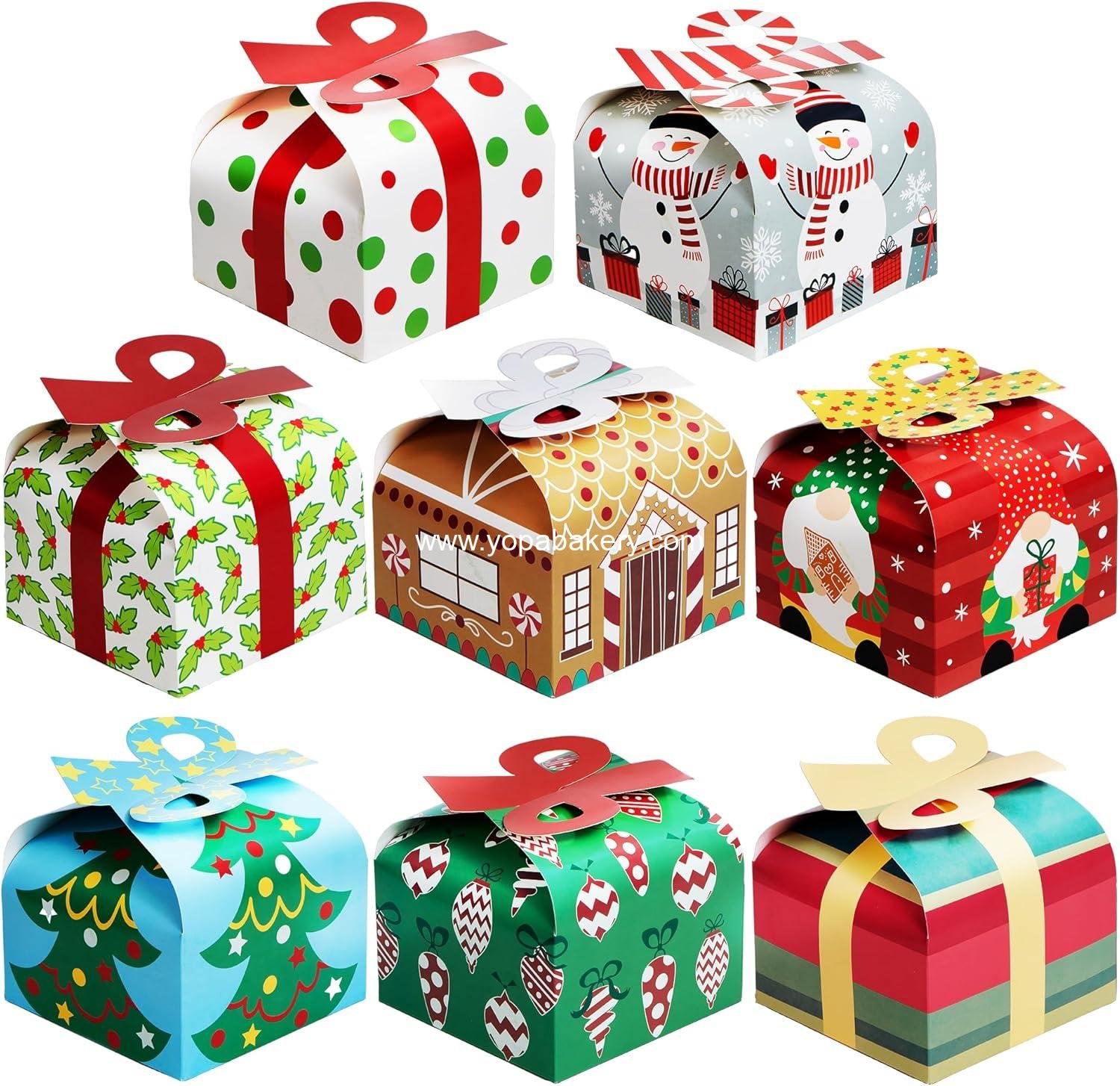 JOYIN 24 PCS 3D Christmas Goody Gift Boxes with Bow for Holiday Xmas Goodie Paper Boxes, School Classroom Party Favor Supply, 6” x 6” x 5.5” 8 Designs Candy Treat Cardboard Cookie Box for Gift Giving