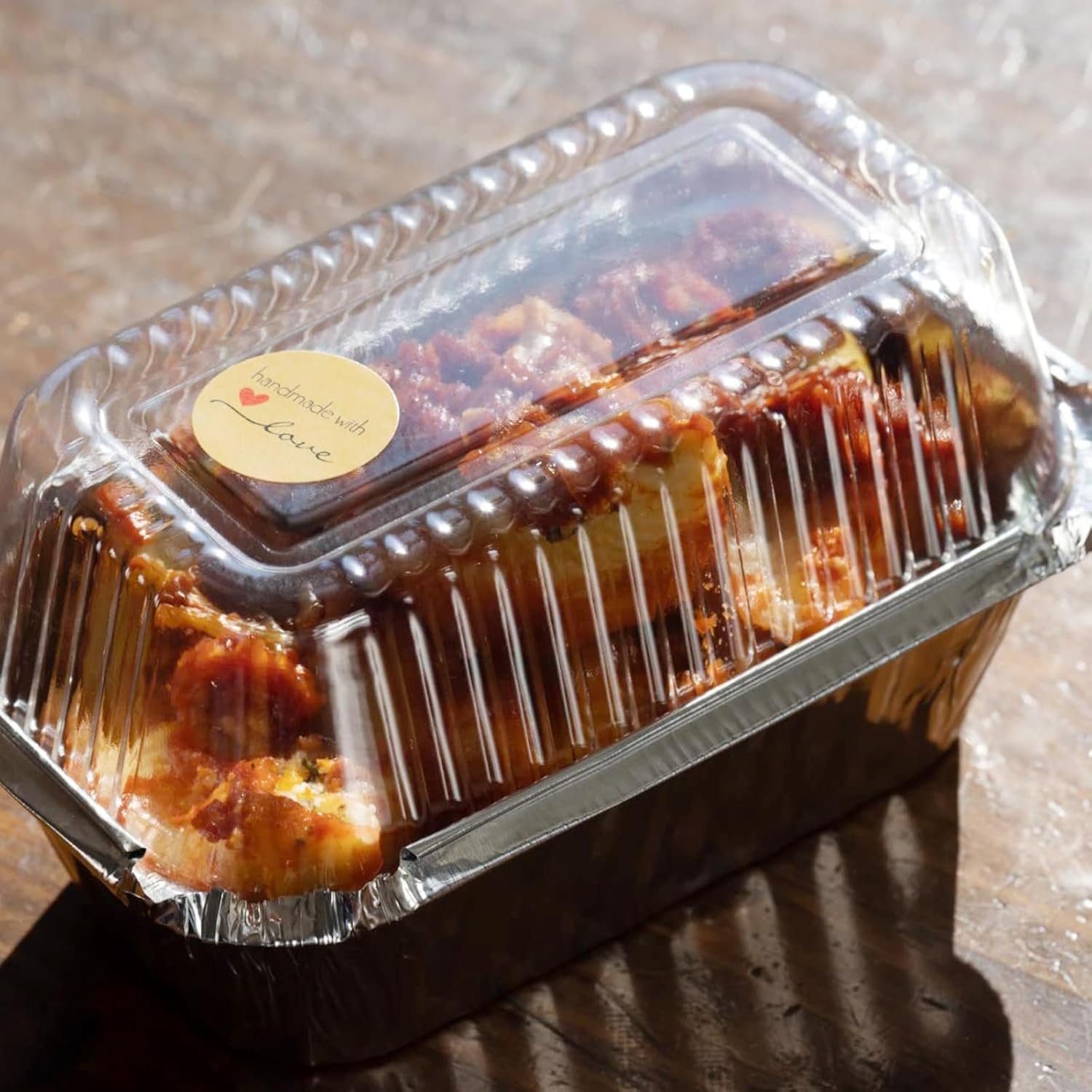 Wholesale 100 Pack 7.8 x 4.53 x 2.17 Inch Disposable Aluminum Loaf Pans with Clear Lids and Strong Seals for Freshness Spill Resistance Manufacturer